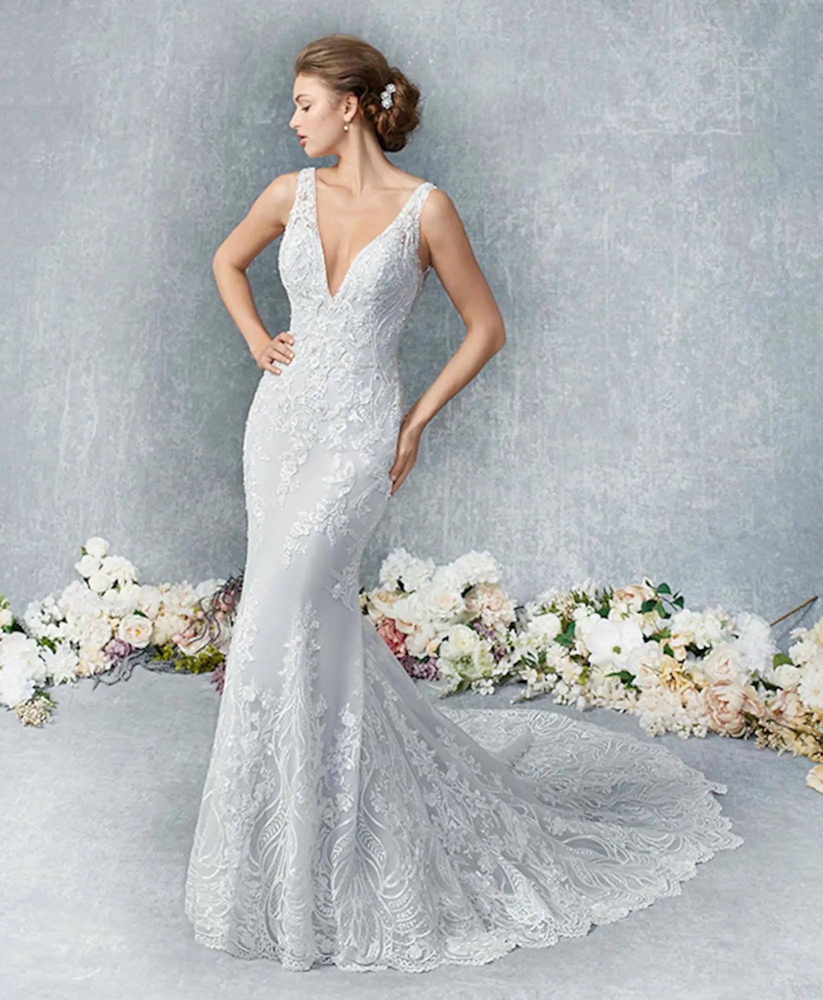 Model wearing lace Kenneth Winston wedding gown. Style 1836