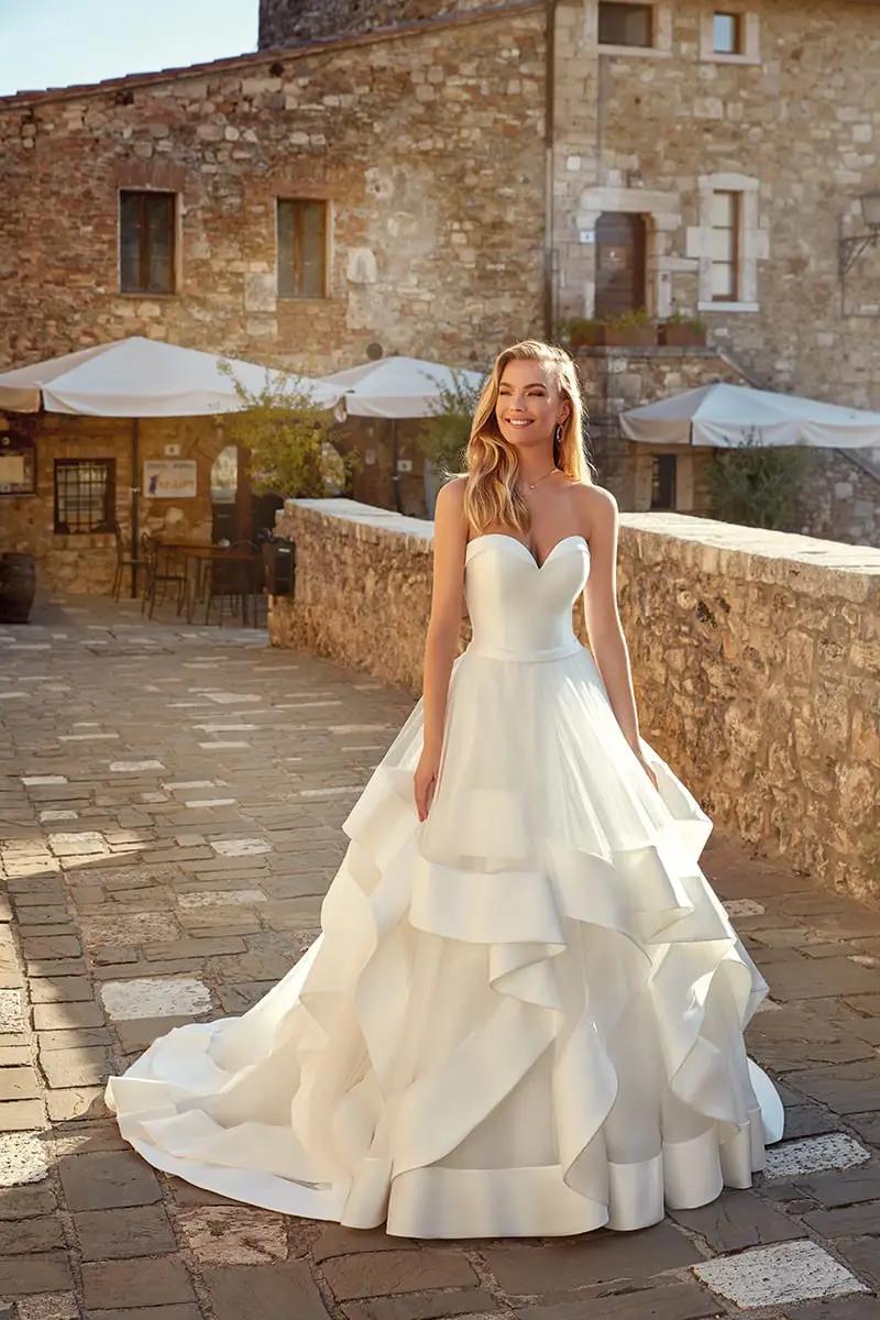Model wearing Eddy K Italia wedding dress. Style EK1356.
